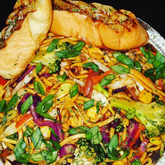 Loaded hot dog on stir-fried noodles